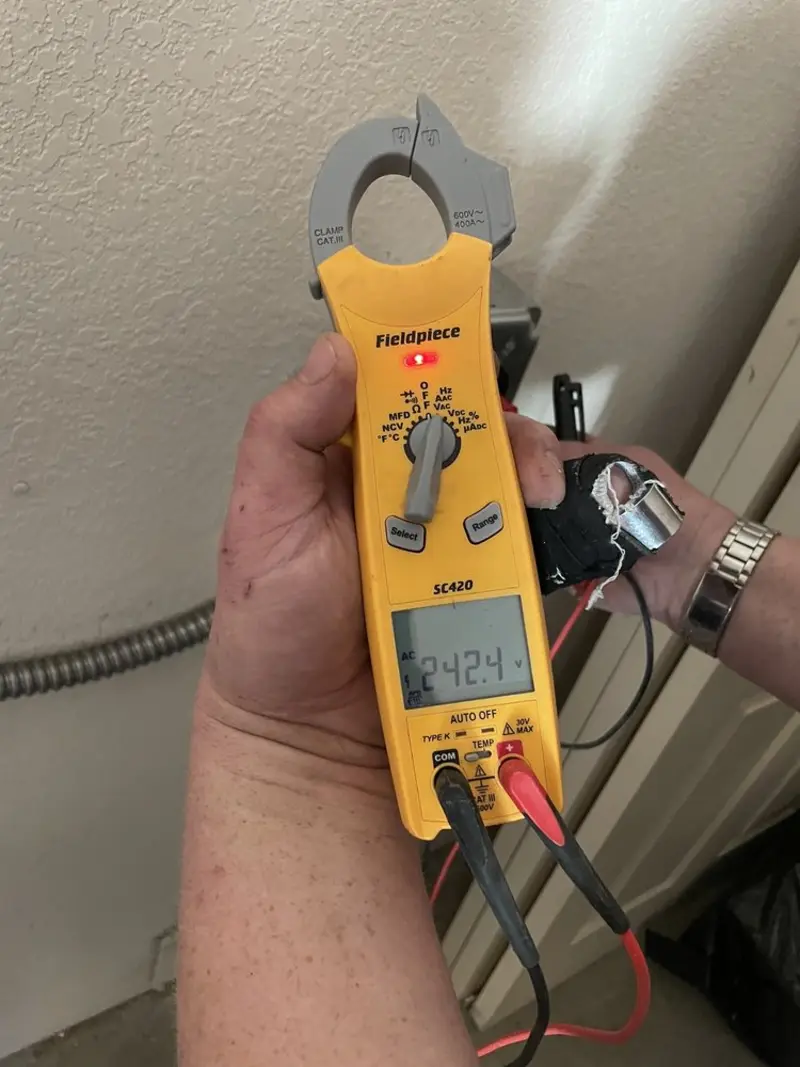 Voltage testing with clamp meter during Recessed Lighting Installation in Upper Milford